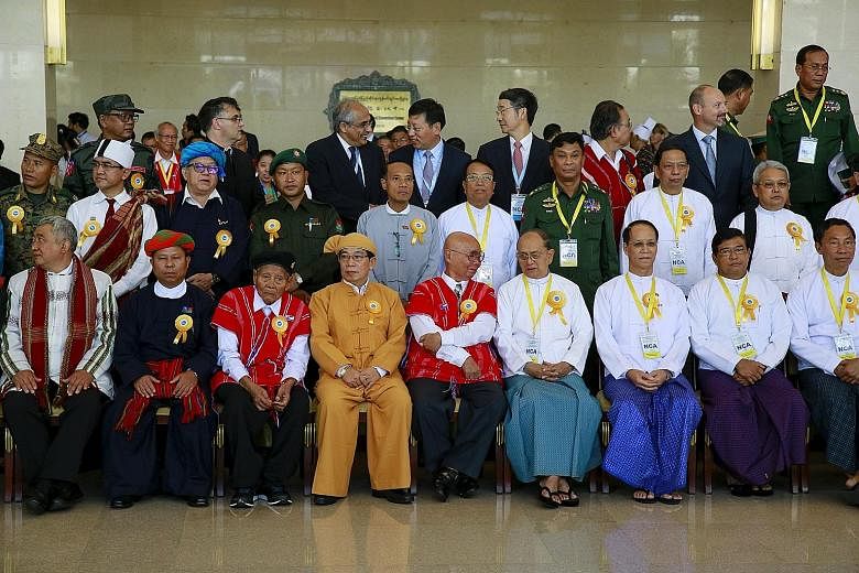 Myanmar President Thein Sein (front row, sixth from left) with government officials, ethnic rebel groups and international witnesses after the signing ceremony of the Nationwide Ceasefire Accord in the capital Naypyitaw yesterday.