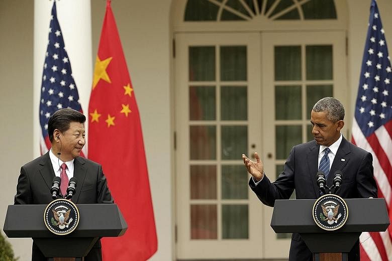 Managing the US-China relationship without war will demand more than just new slogans or more frequent summits of presidents. (Above) China's President Xi Jinping and US President Barack Obama holding a joint news conference at the White House last m