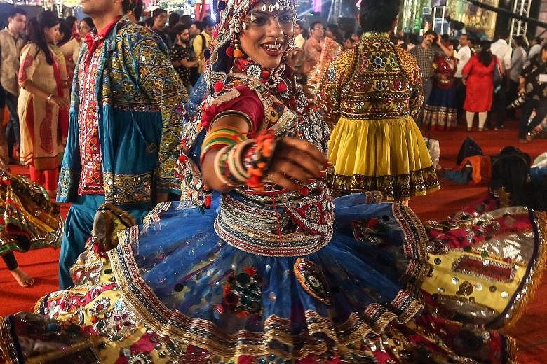 Dancers in traditional attire participating in a Garba performance during the Navaratri festival celebrations in Mumbai, India, on Thursday. The word Navaratri literally means nine nights in Sanskrit, nava meaning nine and ratri meaning nights. Durin