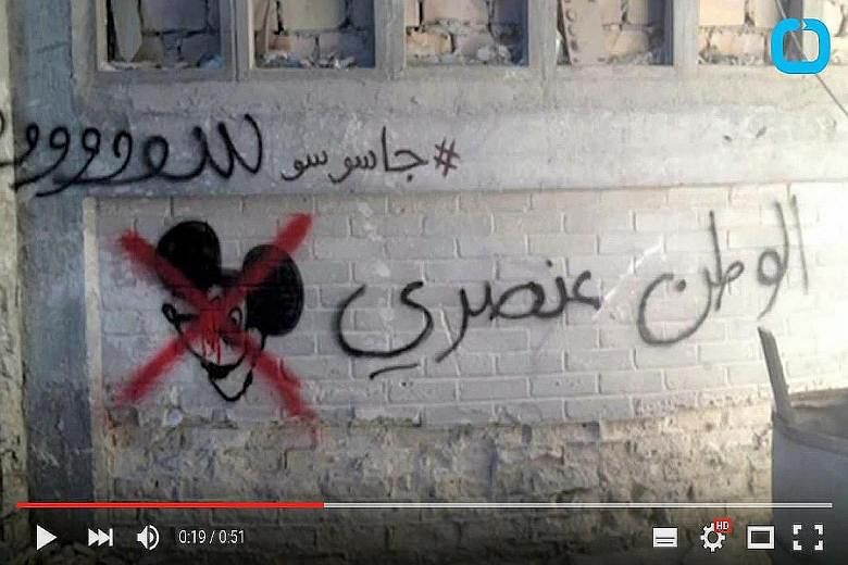 The episode containing slogans criticising the Homeland series went unnoticed and was aired. Left: Arabic graffiti that reads "Homeland is racist".