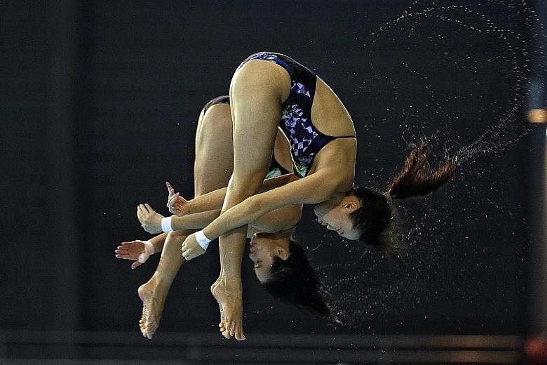 Singapore's Freida Lim (front) and Myra Lee gave home fans plenty to shout about when they came up with their best-ever score in finishing fourth in the synchronised 10m platform.