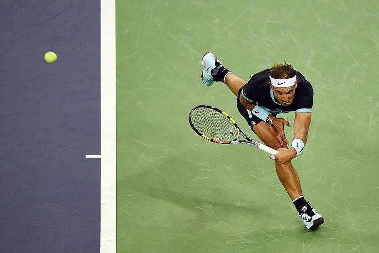 Rafael Nadal of Spain stretching deep for a return during his dominant quarter-final win over Stanislas Wawrinka of Switzerland at the Shanghai Masters yesterday.