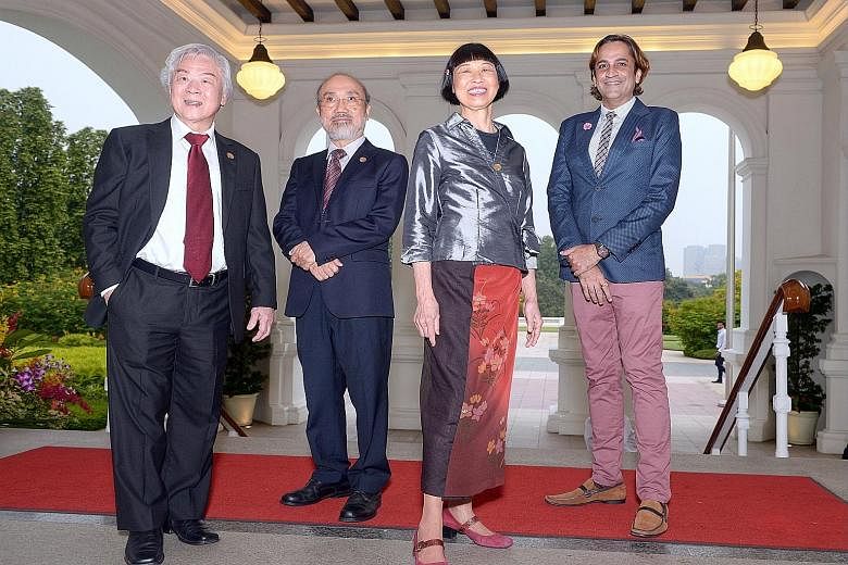 (From left) Painter Chua Mia Tee, writer Lin Gao, virtuoso pianist Margaret Leng Tan and dramatist Haresh Sharma received the Cultural Medallion yesterday at the Istana.