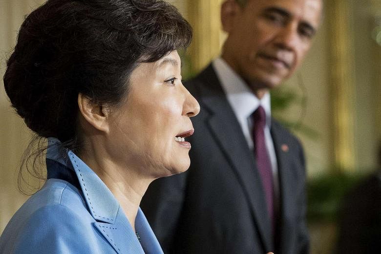 Mr Obama listening to Ms Park speak during the joint press conference in the White House on Friday. Their show of unity is particularly significant as both countries navigate the changing balance of power in North-east Asia.