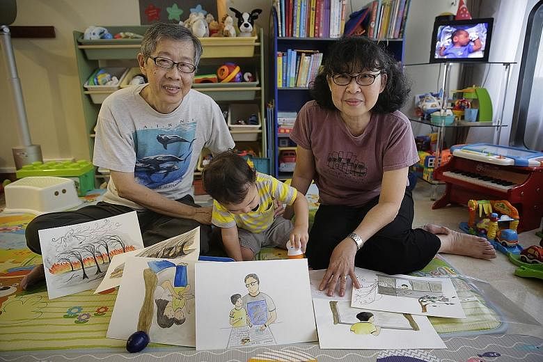Retirees Khoo How San and Angeline Khoo with their grandson Matthew, who inspired them to write Matthew And The Horrid Haze.