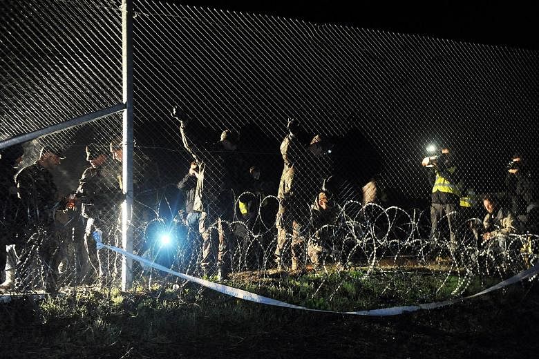 Hungarian police and soldiers closing the Hungary-Croatia border on Friday.