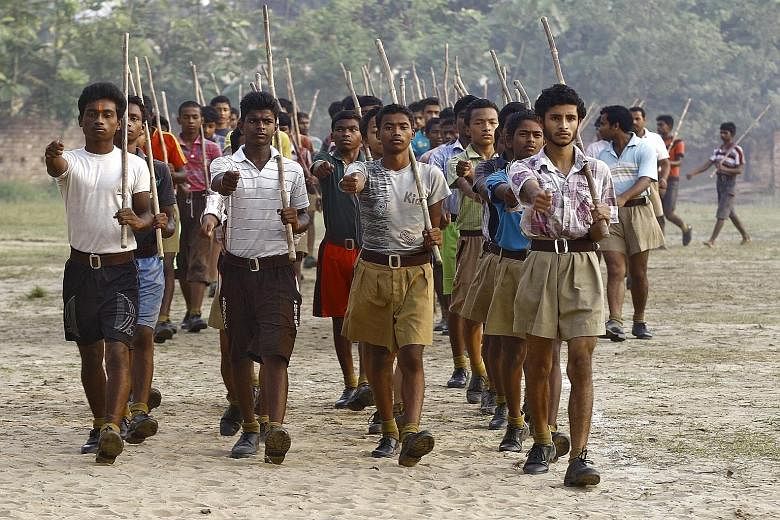 Volunteers of the RSS marching during a training session in Tatiberia village in West Bengal. The RSS, which describes itself as a cultural and social group, is India's most powerful Hindu organisation.