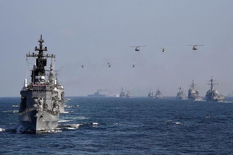 An escort ship from Japan's Maritime Self-Defence Force taking part in a fleet review off Kanagawa prefecture yesterday. Vessels from India, South Korea, Australia, France and the United States also participated.