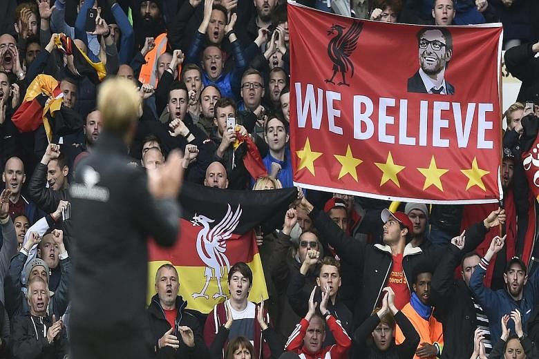 New manager Juergen Klopp and the Liverpool faithful applauding after the 0-0 draw at Spurs. Fans must not expect too much, too soon of the German.