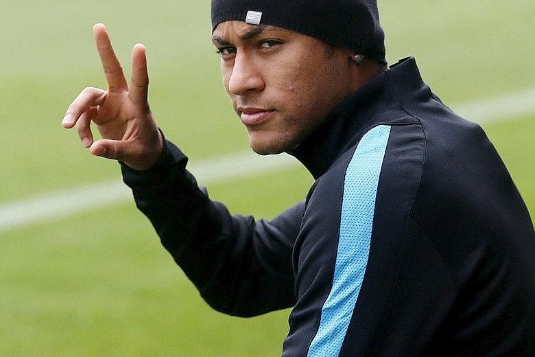 Barcelona's Neymar gestures as he arrives for a training session at Joan Gamper training camp. Barcelona are currently top of Champions League Group E and will face Bate Borisov in Belarus next.