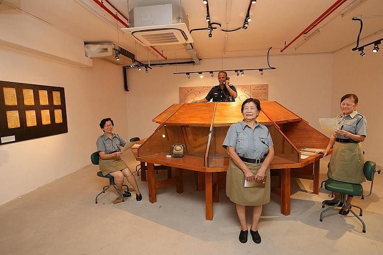 Former "Triple Nine girls" (from left) Evelyn Wong, 71; Lilian Lee, 75; and Lorna Jenner, 70; as well as former police officer George Mathews, 65, at a bunker once known as the Combined Operations Room in Pearl's Hill Terrace in Chinatown. They are i