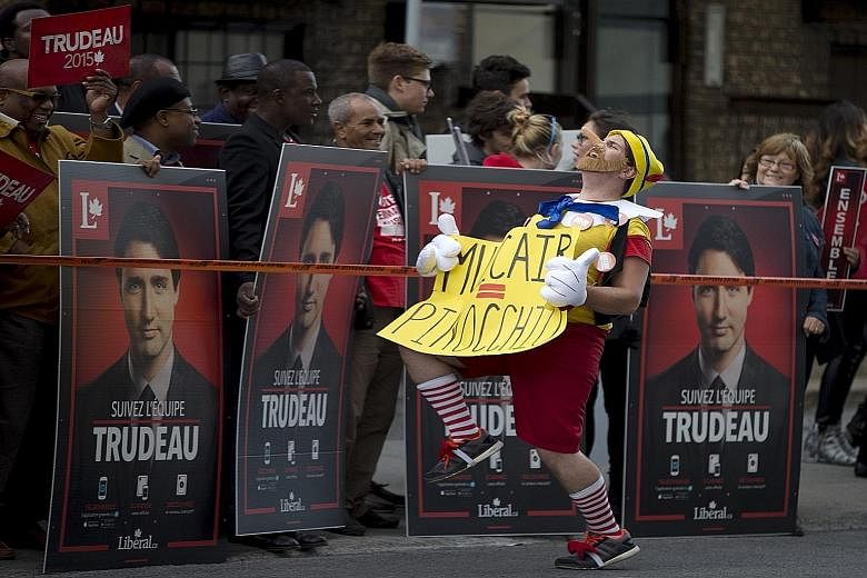 An anti-NDP protester in front of Liberal leader Justin Trudeau's supporters in Quebec this month. The Canadian federal election campaign has been far from dull, with lots of wacky moments for voters to delight in.