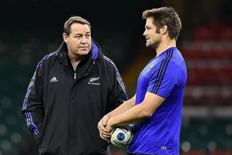 New Zealand head coach Steve Hansen (left) discussing tactics with captain Richie McCaw at training in Cardiff last week.