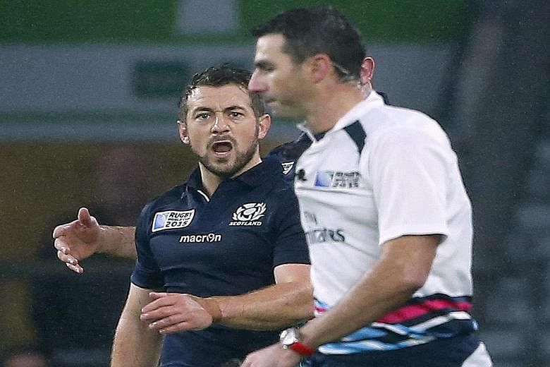 An aggrieved Scotland captain and scrum-half Greig Laidlaw shouting at referee Craig Joubert after he awarded a penalty to Australia in the last minute of their quarter-final. Bernard Foley's kick gave the Wallabies a 35-34 win.