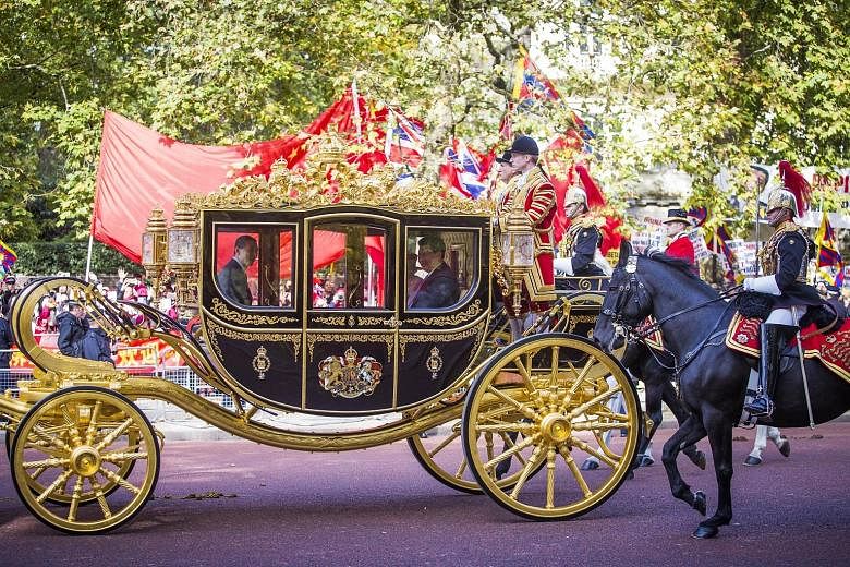 Queen Elizabeth II and Chinese President Xi Jinping travelling together yesterday in the Diamond Jubilee State Coach to Buckingham Palace, where they had a private lunch.