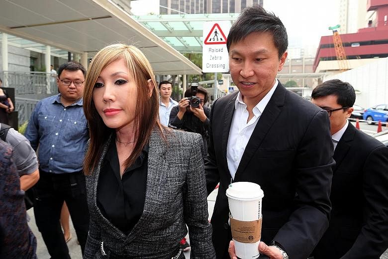 CHC founder Kong Hee and his wife Ho Yeow Sun arriving at the courts yesterday.