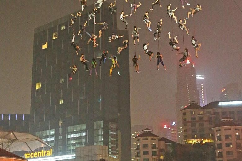 Forty-two brave souls - all volunteers and based in Singapore - rehearsing for the death-defying Human Net performance over the Singapore River on Tuesday night. The act is part of Spanish performance troupe La Fura dels Baus' showcase for the three-