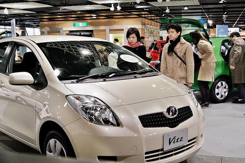 A Toyota compact car, the Vitz, which is exported under the name Yaris. This model is among several that the Japanese auto giant is recalling worldwide over a power window glitch.