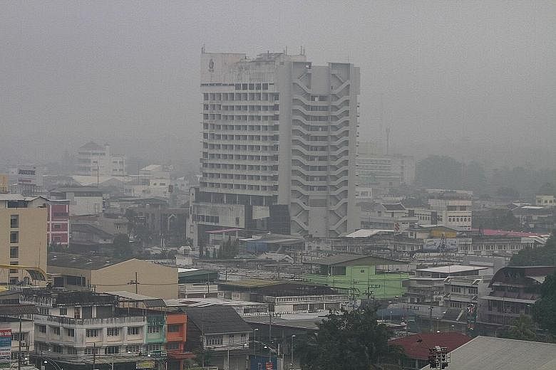 A view of Muang district in the southern province of Yala, Thailand, is pictured shrouded in haze yesterday. In many parts of southern Thailand, air pollutant readings were in the unhealthy range. According to the Ministry of Natural Resources and En