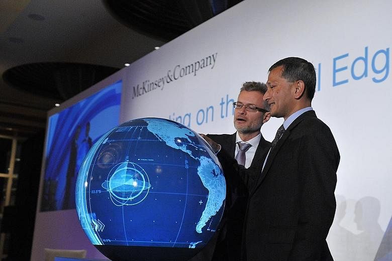 Foreign Minister Vivian Balakrishnan and Mr Oliver Tonby, managing partner for South-east Asia at McKinsey & Company, launching the McKinsey Digital Campus at the 9th McKinsey Innovation Forum yesterday.