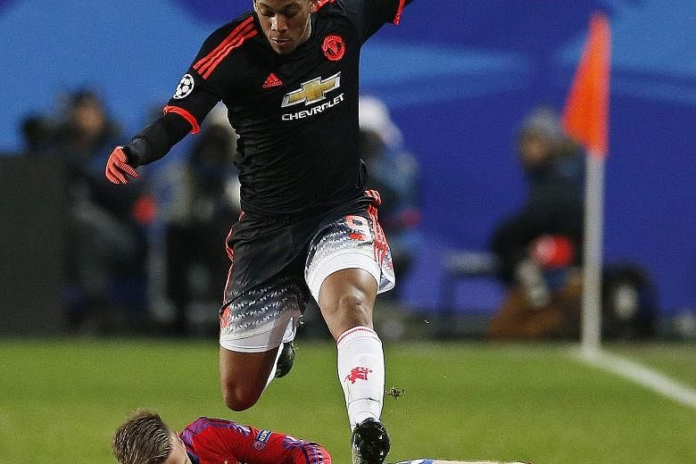 Anthony Martial in full flight against CSKA Moscow. He made amends for conceding a penalty by heading home the 65th-minute equaliser in the 1-1 draw.