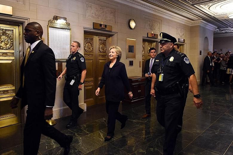 Former secretary of state and Democratic Presidential hopeful Hillary Clinton arriving to testify before the House Select Committee on Benghazi on Capitol Hill in Washington, DC yesterday.