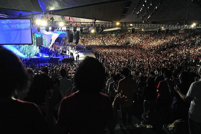 The church's congregation has gone from 23,565 in 2009 to 17,522 last year. (Left) A City Harvest Church service held on March 19, 2011 at Suntec convention centre.