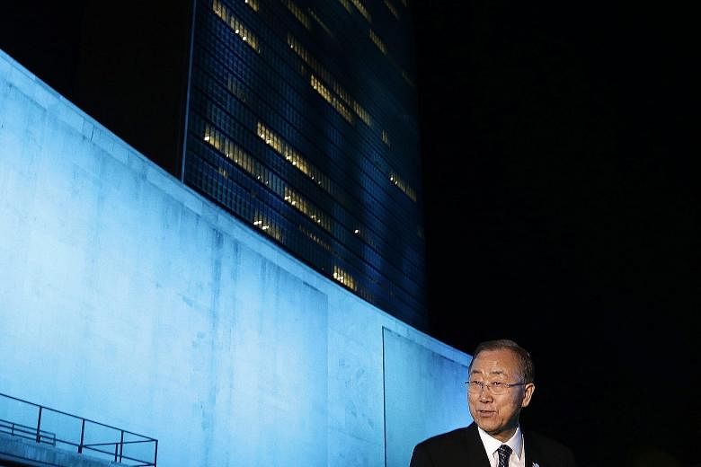 United Nations Secretary- General Ban Ki Moon in front of the UN General Assembly Hall on Friday to mark the UN's 70th anniversary. To commemorate the milestone yesterday, about 200 landmarks across the world - including six in Singapore - were lit u
