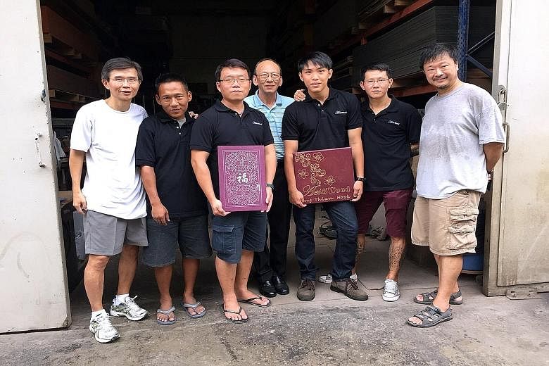 The team at Aestiwood, a woodwork company which hires former convicts. (From left) Mr Ang Thiam Hock, Mr Ng Lye Choon, Mr Siow Peng Guan, Uncle Chiu, Mr Acer Wong, Mr Ang Kim Song and Mr Patrick Chan. Besides Mr Ang Thiam Hock and Mr Chan, Uncle Chiu