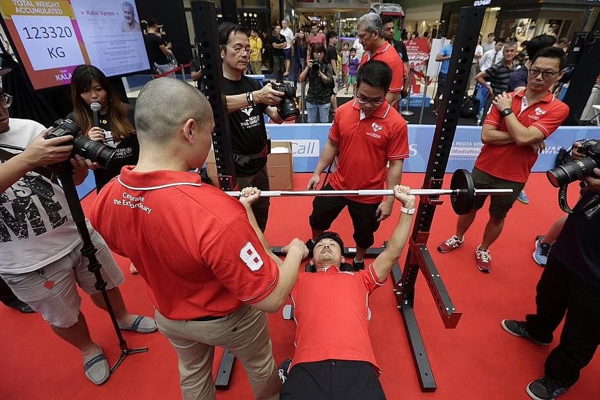 Parliamentary Secretary (Culture, Community and Youth) Baey Yam Keng trying his hand at powerlifting yesterday.