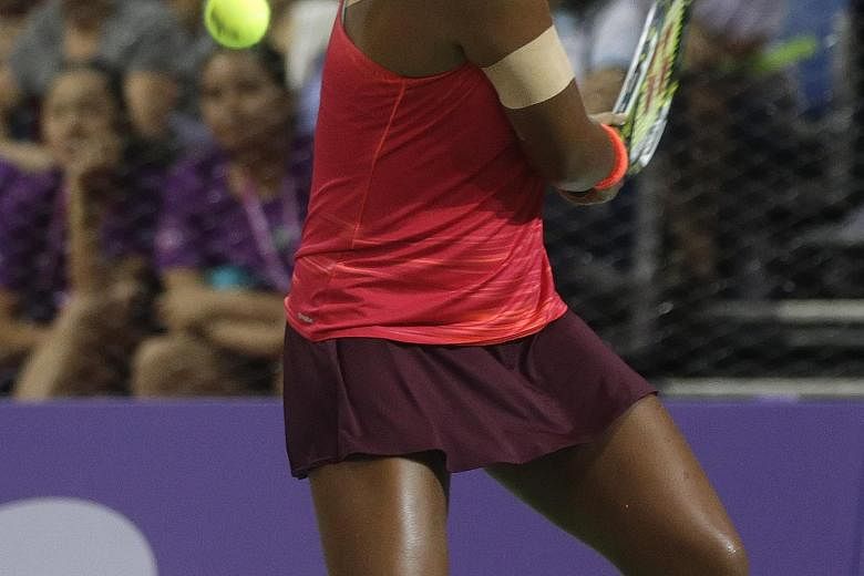 Japan's Naomi Osaka in action yesterday at the OCBC Arena where she beat China's Zhu Lin 4-2, 2-4, 5-4 to earn a place in the final of the WTA Rising Stars Invitational. The final, held at the Singapore Indoor Stadium today, will pit the 17-year-old 