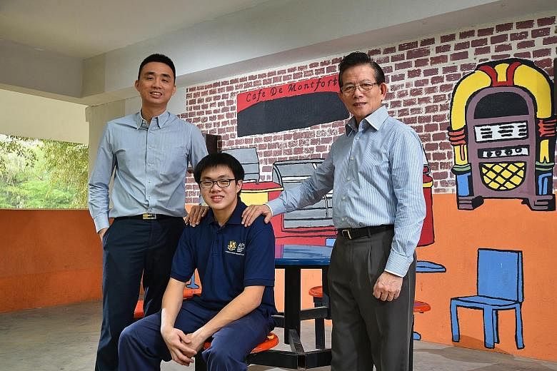Assumption Pathway student Ng Wei Ming (centre), 19, works three days at a hotel and spends two days in school, where he gets to consult job coaches Royston Alvin Ang (far left) and Ronnie Ho.