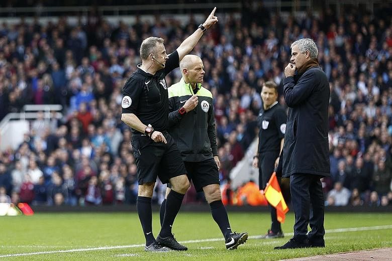 Jose Mourinho looking shocked as referee Jonathan Moss sends goalkeeping coach Christophe Lollichon and assistant first-team coach Silvino Louro (neither in the picture) to the stands. The Chelsea manager subsequently joined them for the second half 