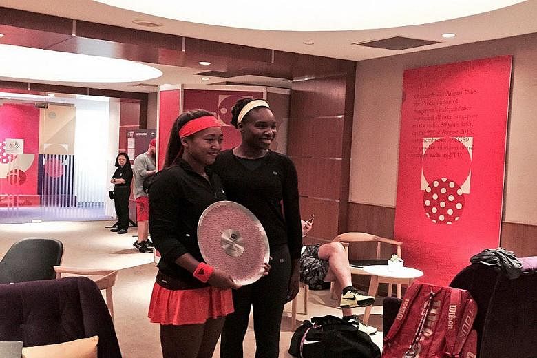 A starstruck moment for WTA Rising Stars winner Naomi Osaka, 18, as she meets former world No. 1 Venus Williams in the players' lounge yesterday.