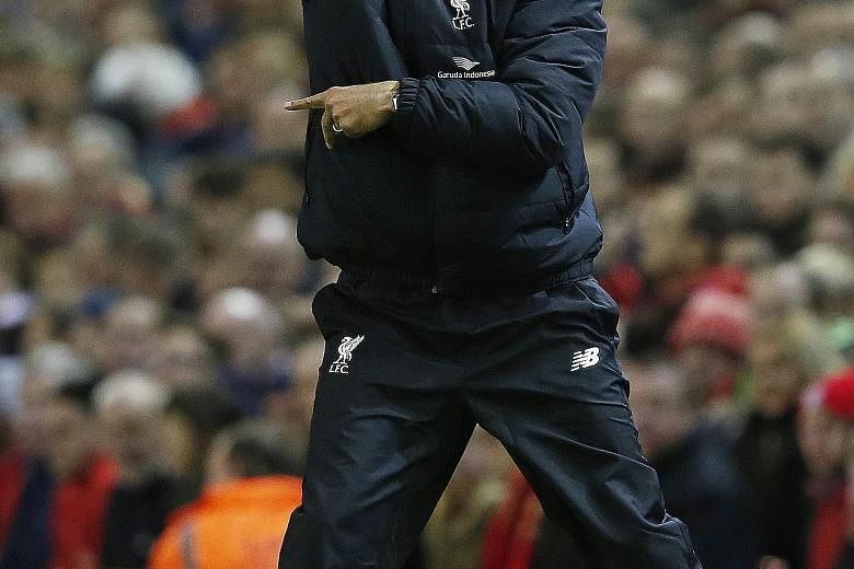 Juergen Klopp shows his delight as Liverpool score the opening goal of the Premier League match against Southampton on Sunday. He was disappointed with the eventual 1-1 draw, but said: "We had our moments."