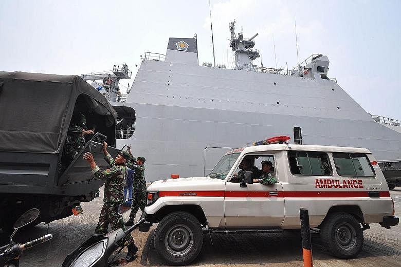 Indonesian soldiers arriving at the Trisakti port in Banjarmasin, South Kalimantan, yesterday, ahead of haze-relief operations. The number of people who have been treated for haze-related illness across Indonesia has breached the half-million mark; 1