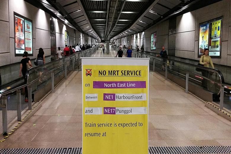 The scene at Serangoon MRT station yesterday morning, when the NEL was down for nearly two hours. The power fault was caused by a new train tugging onto the overhead power system and snapping a wire during tests.