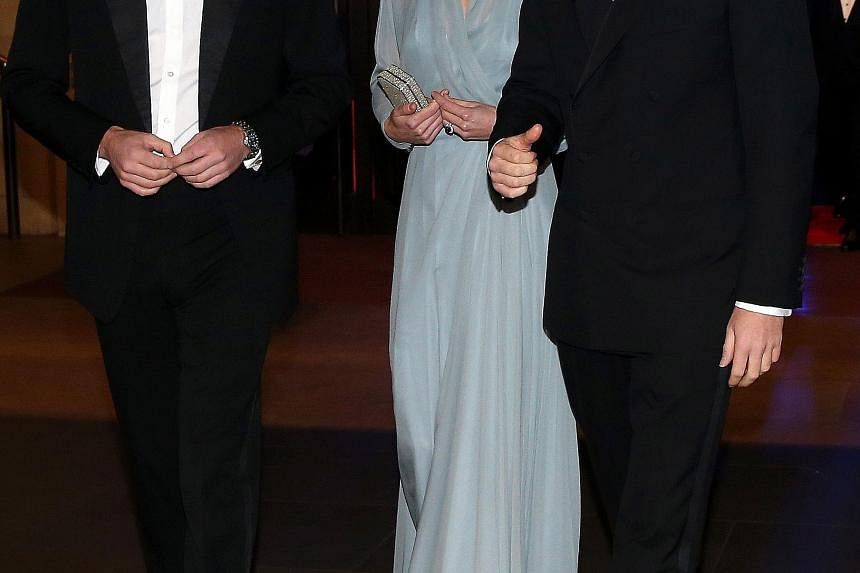 Britain's Prince William, his wife Kate and his brother Prince Harry (all above) were at the premiere of Spectre, which stars Lea Seydoux, Daniel Craig and Monica Bellucci.
