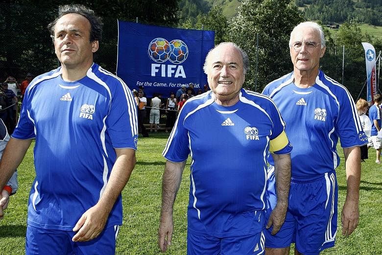 A file picture dated Aug 26, 2007 shows (from left) Uefa president Michel Platini, Fifa president Sepp Blatter and Franz Beckenbauer in happier times as they turn up for a gala match in the 10th edition of the Sepp Blatter Tournament in Ulrichen, Swi