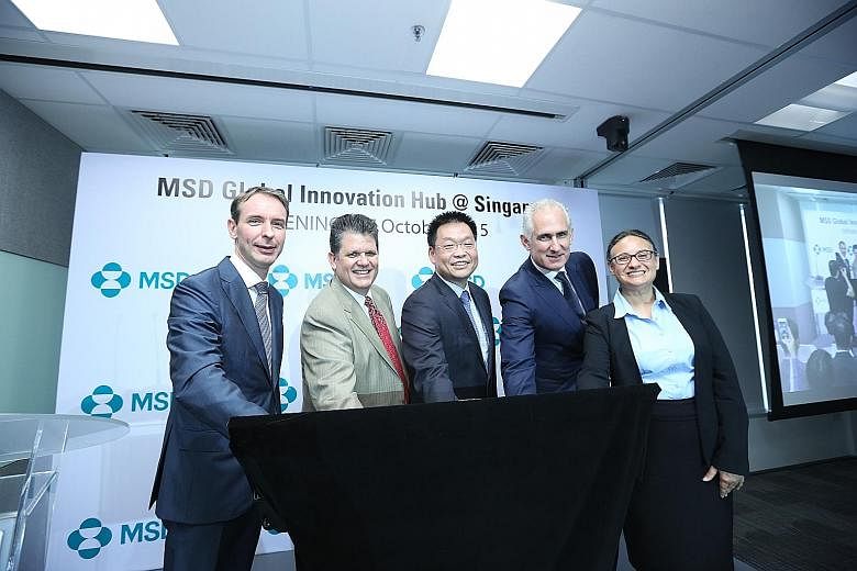 Mr Yeoh Keat Chuan (centre), managing director of the Economic Development Board, with (from left) Mr Jan Van Acker, president, Asia-Pacific, MSD; Mr Clark Golestani, executive vice-president and chief information officer; Mr Kevin Ali, president of 