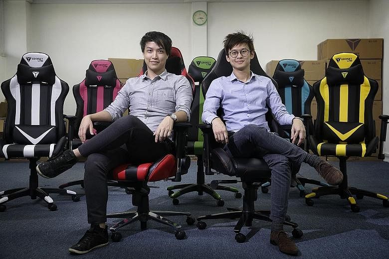Secretlab founders Alaric Choo (far left, on the Throne V2) and Ian Ang (left, on the Omega). The impetus to set up Secretlab came last December, when Mr Ang was moving house and wanted to buy a gaming chair for his new computer set-up.