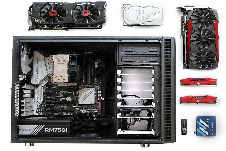 (Above) The computer built by The Straits Times. The key components of a gaming system include a graphics card (or two), a motherboard (inside the chassis), the memory and storage drives.