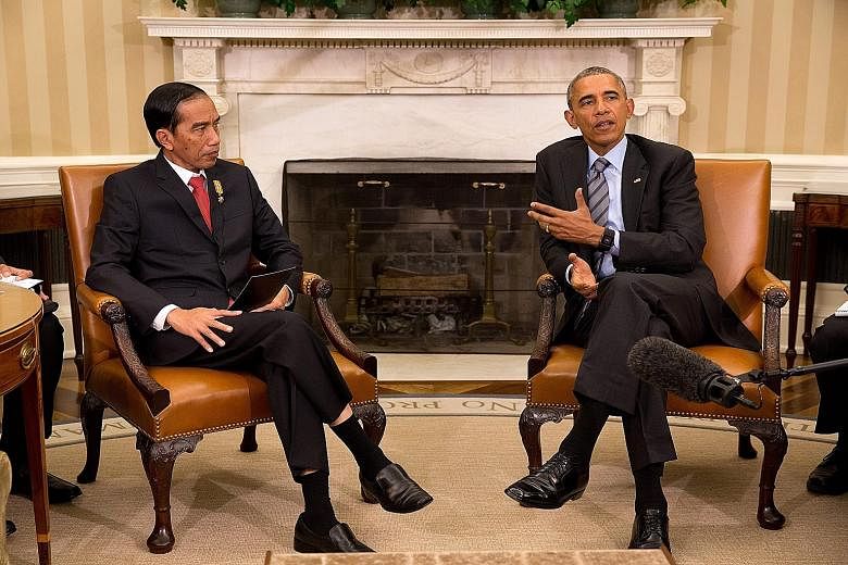 Indonesian President Joko Widodo (left) meeting US President Barack Obama in the Oval Office of the White House on Monday. The two leaders had wide-ranging discussions on issues such as maritime security, counter-terrorism and climate change.