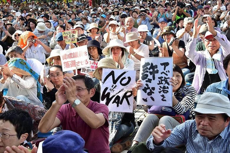 Demonstrators protesting against Prime Minister Shinzo Abe's security Bills and his nuclear policy in Tokyo last month. Okinawa has been battling Tokyo over the relocation of the Futenma airbase.