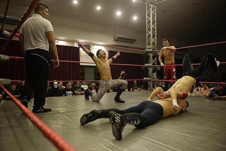 The Ladykiller (Dennis Hui, centre), 29, makes a big display of machismo before executing a move during a tag team match in Prove 5. Theatrics form a large part of pro wrestling entertainment.