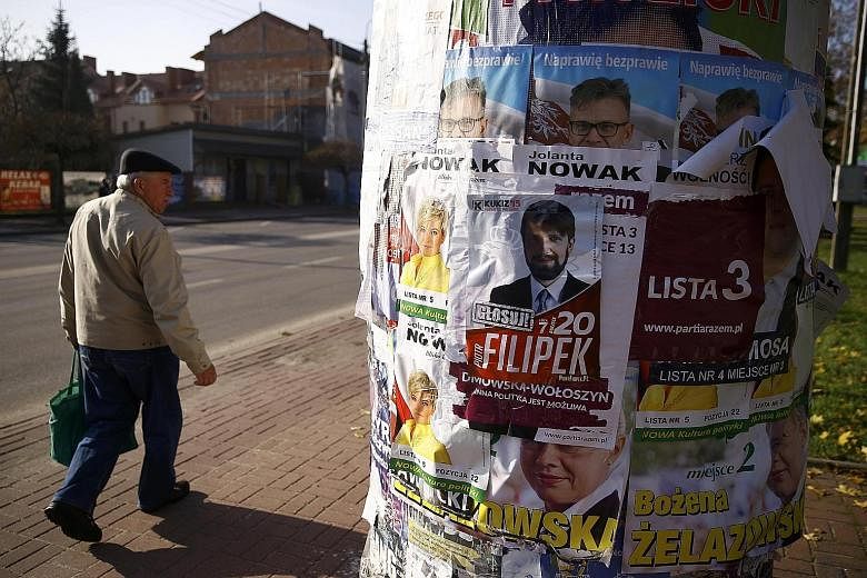 A pillar covered with election posters in Radzymin near Warsaw. Civic Platform lost because it failed to explain to Poles that elections are a choice, not an auction between competing lists of promises, with victory simply going to the highest bidder