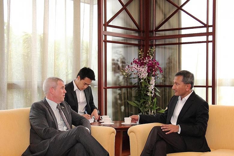 US Ambassador Kirk Wagar (far left) paying Foreign Minister Vivian Balakrishnan an introductory call on Tuesday. Yesterday, Dr Balakrishnan met Chinese Ambassador Chen Xiaodong (above, right).