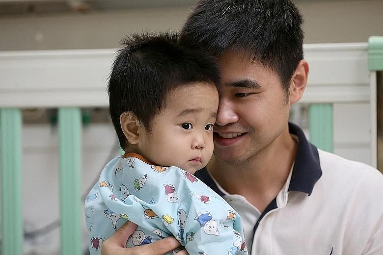 Mr Guo Yang with his son Jeremy on Aug 26, before the boy was discharged from hospital 25 days after his liver transplant operation. An ST team was allowed to document Jeremy's 12-hour transplant on Aug 1.