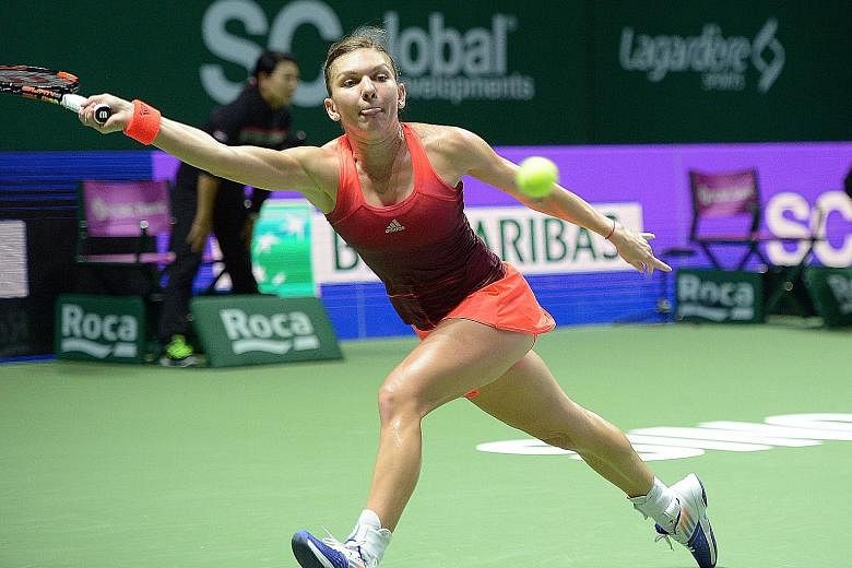 Simona Halep stretching for a deep forehand return to Agnieszka Radwanska. Last year's losing finalist and 2015 top seed is out.