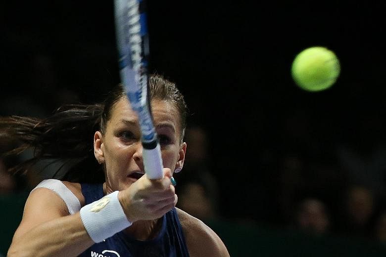 Petra Kvitova taking it out on her racquet after losing a point. Poland's Agnieszka Radwanska is the new year-end world No. 5 after beating the Czech Petra Kvitova 6-2, 4-6, 6-3 to win the WTA Finals title at the Singapore Indoor Stadium.